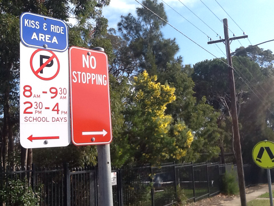 Kiss and ride sign